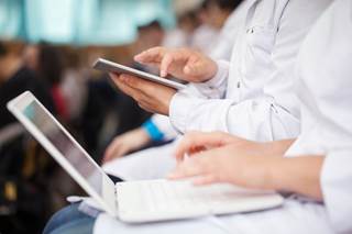Reducing the number of computers on wheels in a surgical intensive care unit can reduce barriers to communication during patient presentations. Reducing the number of computers on wheels in a surgical intensive care unit can reduce barriers to communication during patient presentations.
